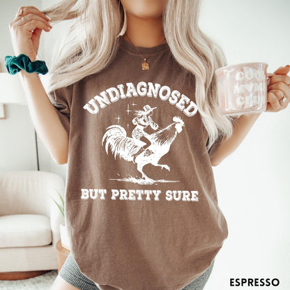 Comfort Colors tee in Espresso featuring western style graphic of a cowgirl riding a large rooster