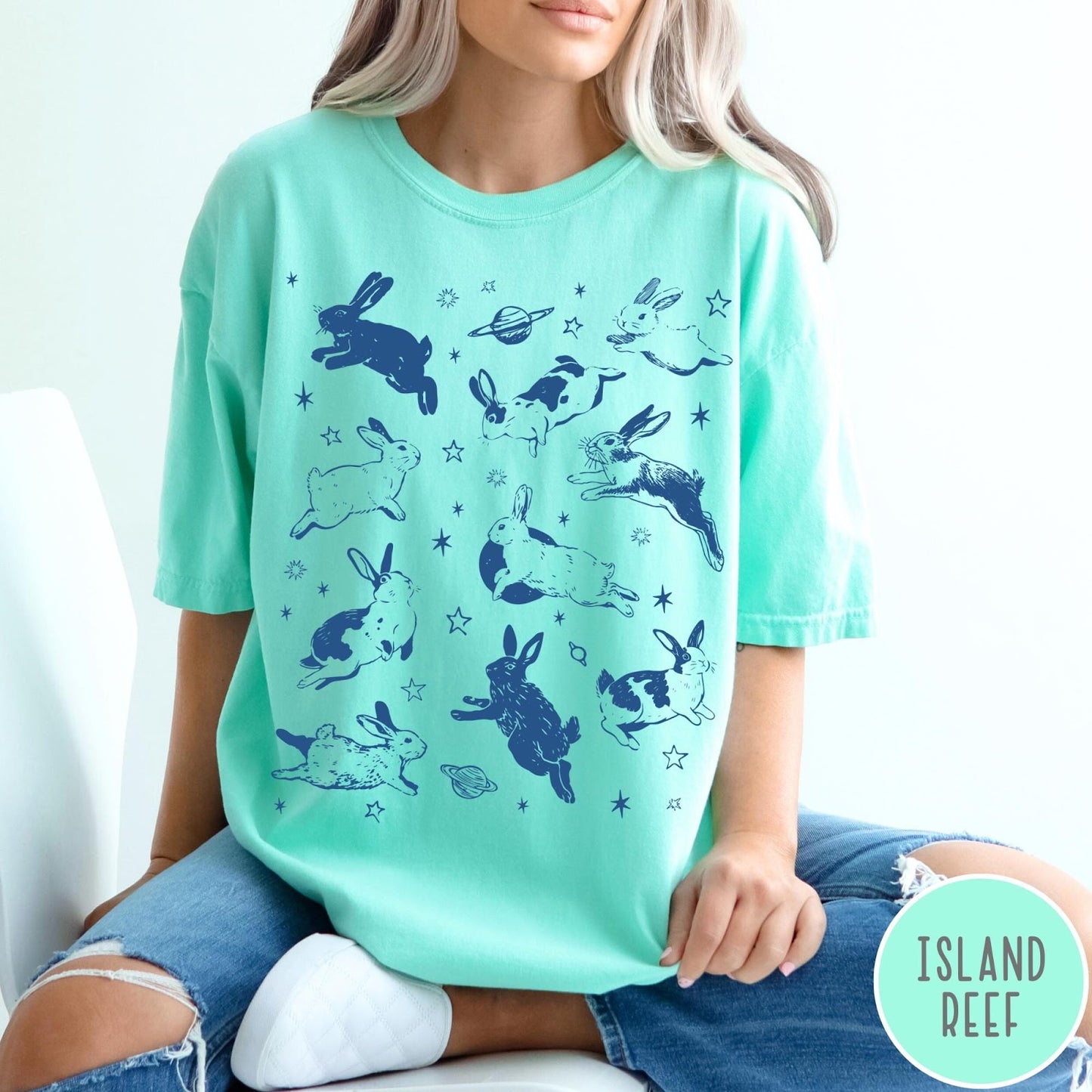 Comfort Colors tee in Island Reef featuring celestial design style with jumping bunnies and planets graphic print