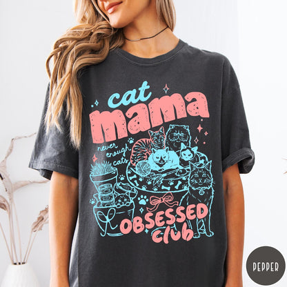 Comfort Colors tee in Pepper featuring cat mama club graphic with multiple cats and pink blue ink