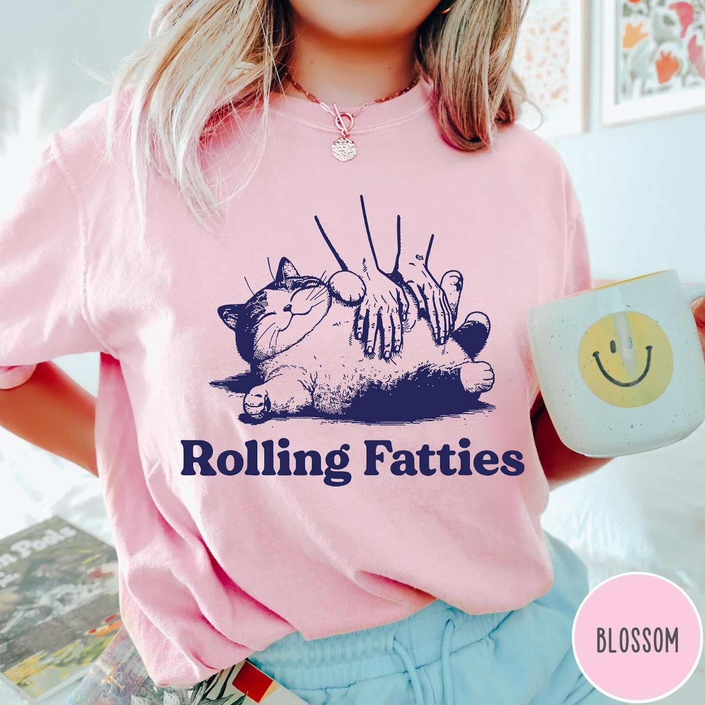 Comfort Colors tee in Blossom featuring illustration style graphic of a chubby cat getting a belly rub
