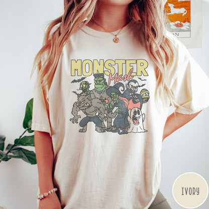 Comfort Colors tee in Ivory featuring retro Halloween style graphic with various classic monsters and spooky characters