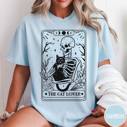 Comfort Colors tee in Chambray featuring tarot style graphic of a skeleton holding a black cat