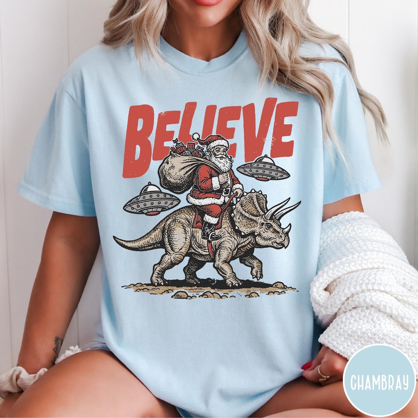 Comfort Colors tee in Chambray featuring vintage style graphic of Santa riding a dinosaur with flying saucers