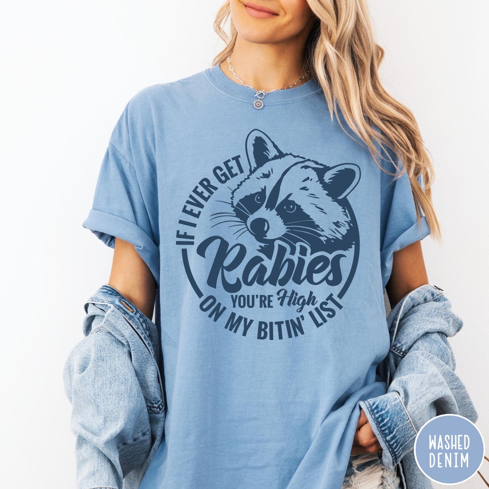 Comfort Colors tee in Washed Denim featuring raccoon graphic with text If I Ever Get Rabies You're High On My Bitin' List