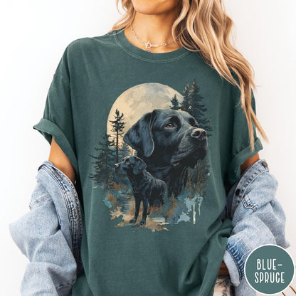 Comfort Colors tee in Blue Spruce featuring artistic graphic of Black Labrador dogs in a forest moon setting