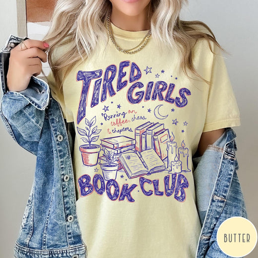 Comfort Colors tee in Butter featuring book club design with stacks of books, plants, and candles.