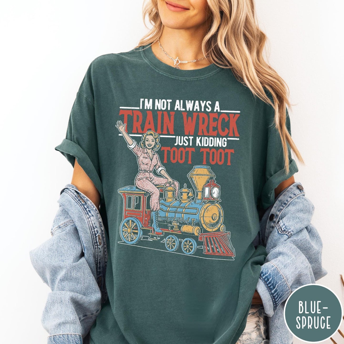 Comfort Colors tee in Blue Spruce featuring vintage style pin-up woman sitting on a steam train graphic