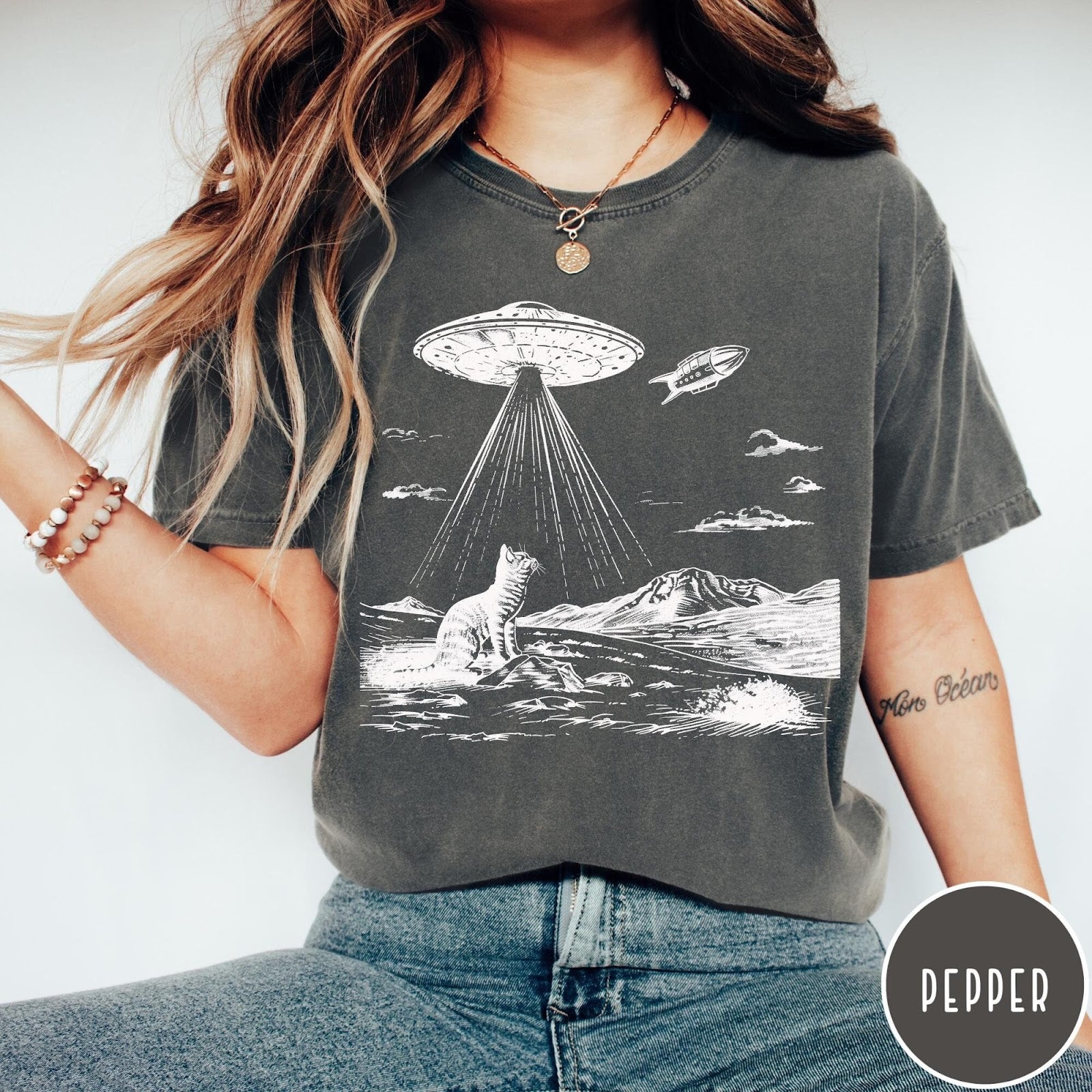 Comfort Colors tee in Pepper featuring retro graphic style cat and UFO abduction scene in white ink