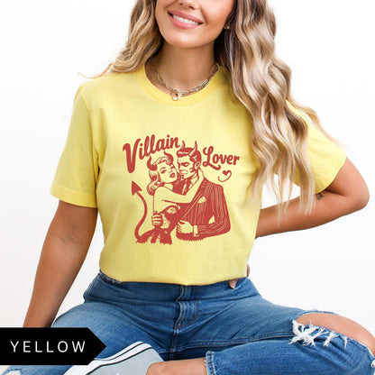 Comfort Colors tee in Yellow featuring vintage style graphic of a devilish couple embracing with text Villain Lover