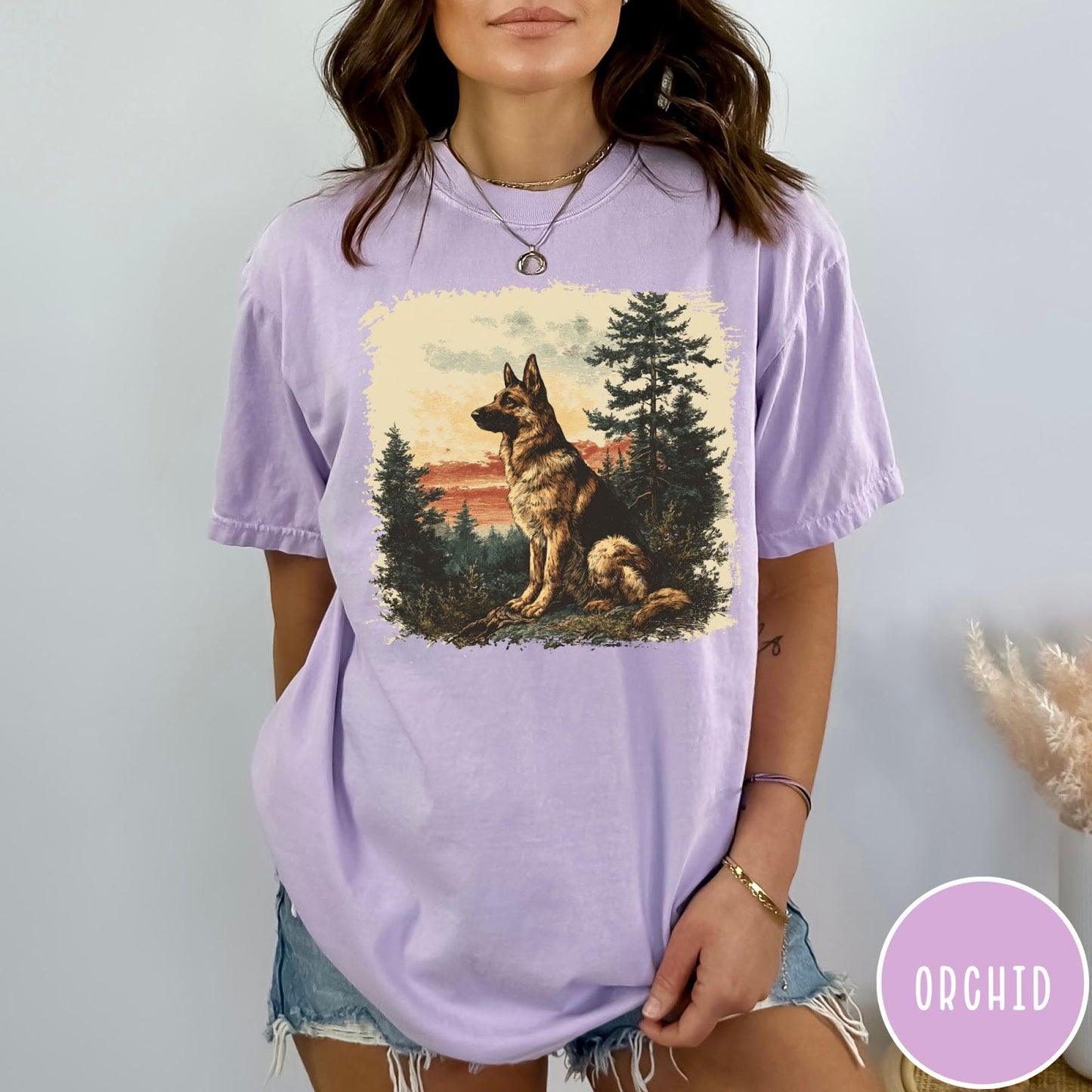 Comfort Colors tee in Orchid featuring vintage style graphic of a German Shepherd sitting in a forest
