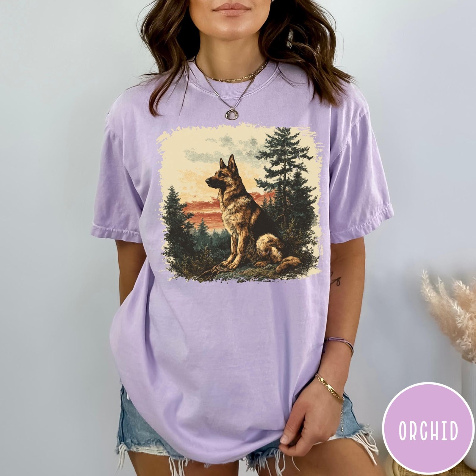 Comfort Colors tee in Orchid featuring vintage style graphic of a German Shepherd sitting in a forest
