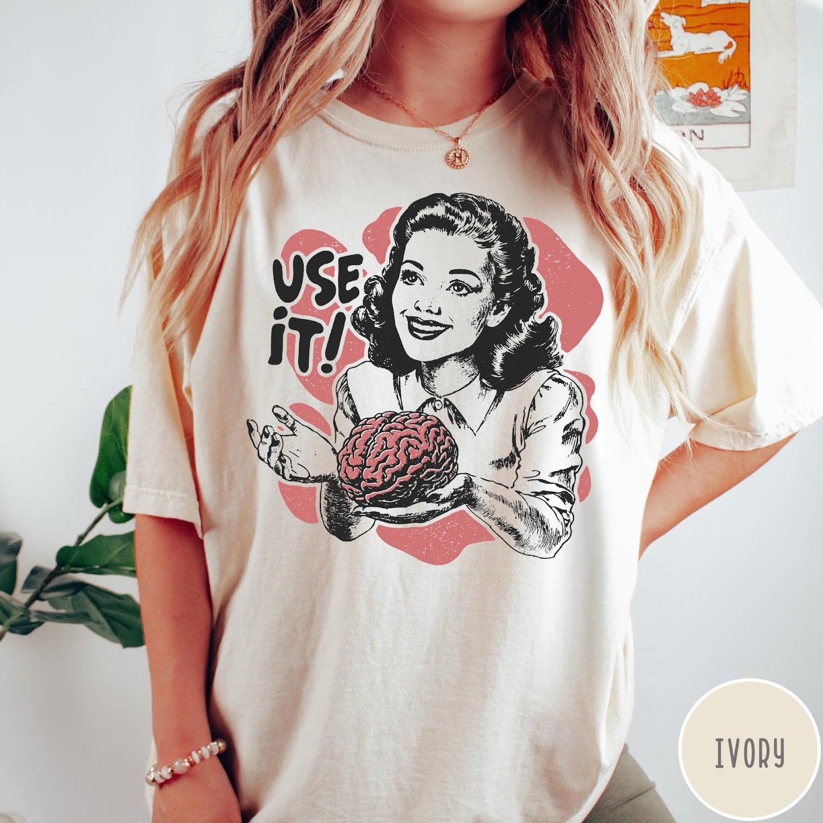 Comfort Colors tee in Ivory featuring retro style graphic of a woman holding a human brain