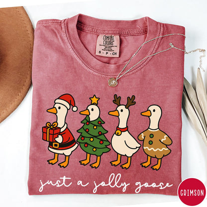 Comfort Colors tee in Crimson featuring festive geese graphic with Santa, Christmas tree, reindeer, and gingerbread goose designs