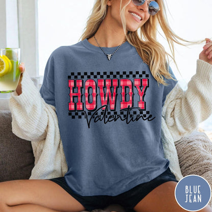Comfort Colors tee in Blue Jean featuring western Valentine greeting with Howdy Valentine text and checkered border graphic