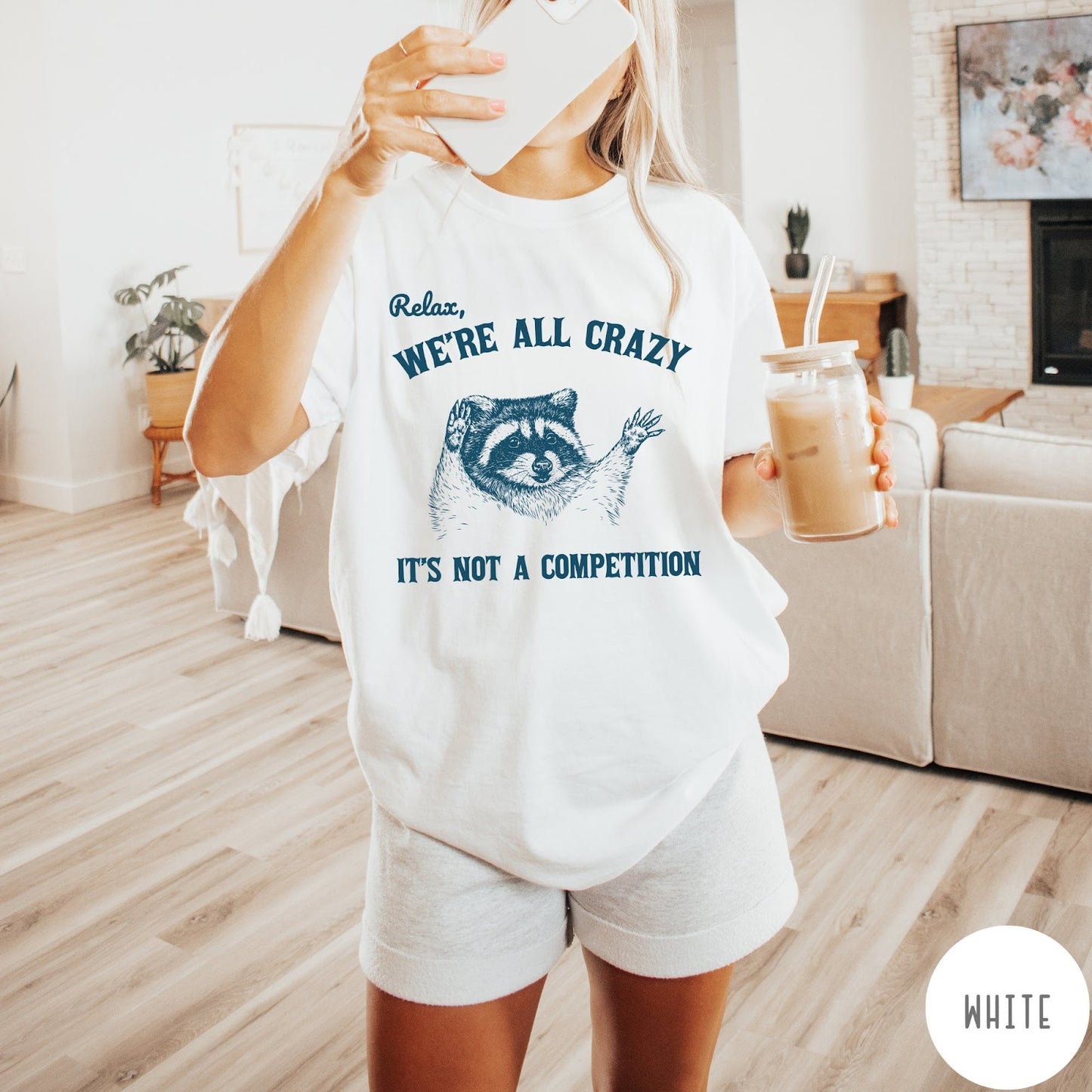 Comfort Colors tee in White featuring screen print style graphic of a raccoon with text Relax We Are All Crazy