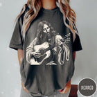 Comfort Colors tee in Pepper featuring vintage style graphic of Jesus playing an acoustic guitar