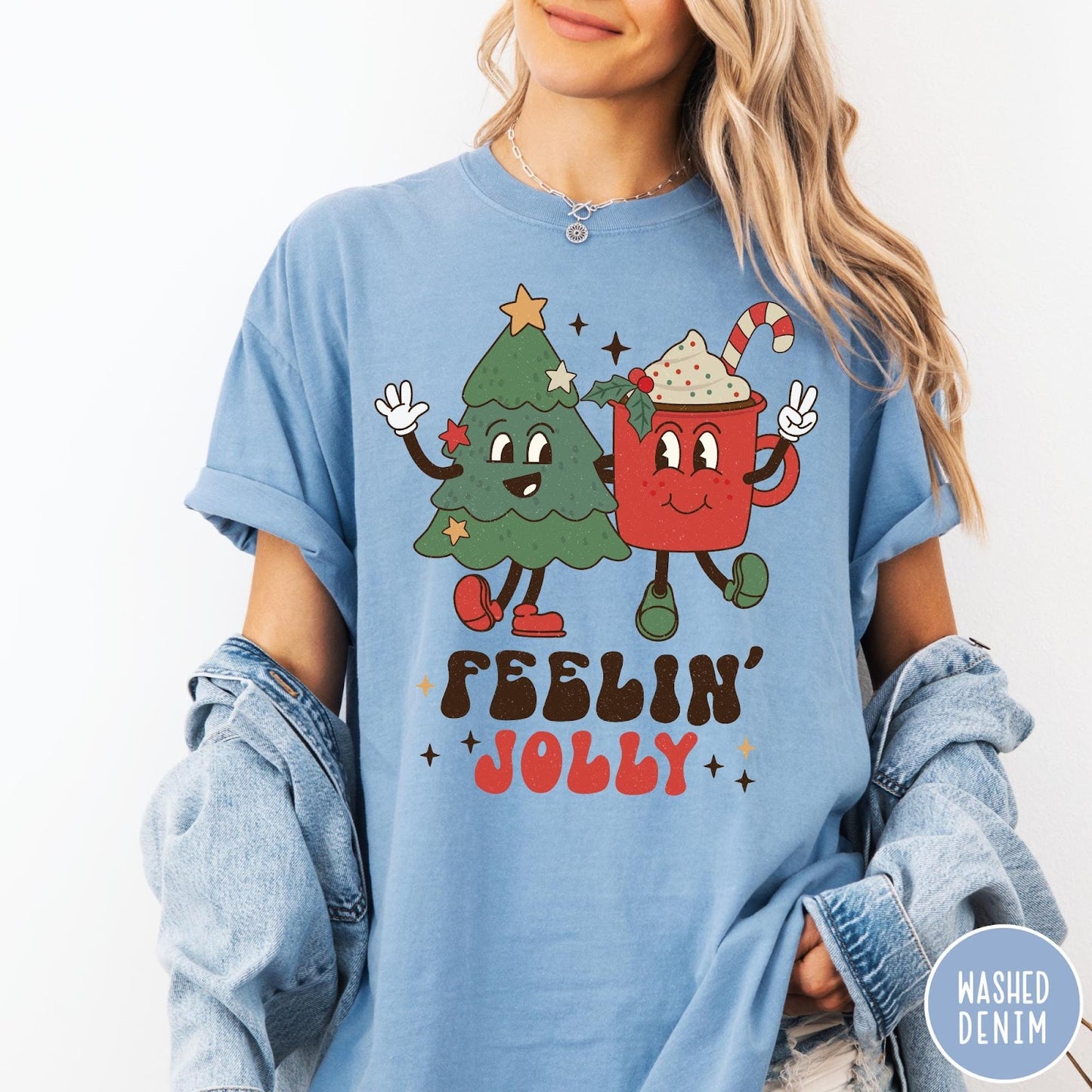 Comfort Colors tee in Washed Denim featuring retro graphic of a smiling Christmas tree and cocoa mug