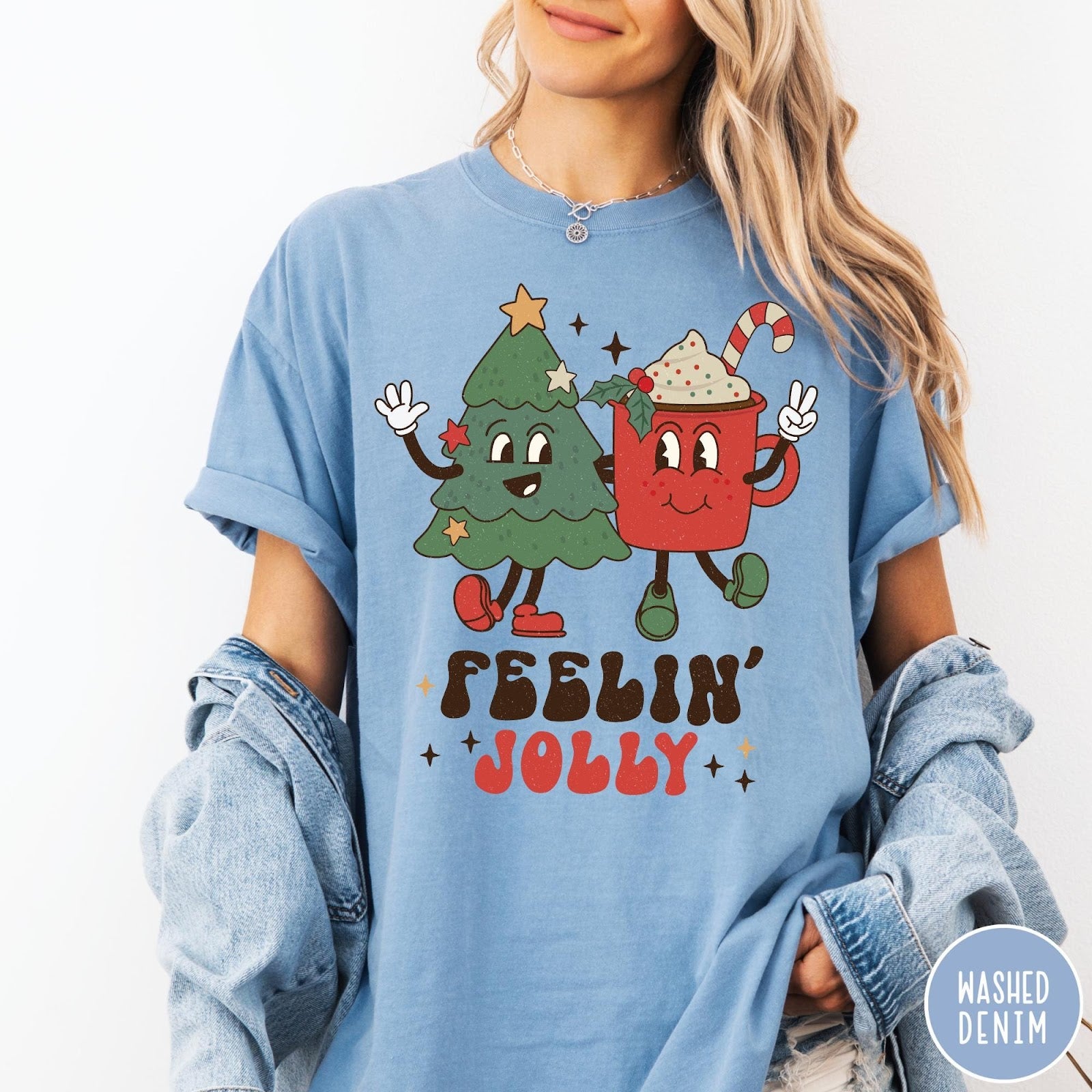 Comfort Colors tee in Washed Denim featuring retro graphic of a smiling Christmas tree and cocoa mug