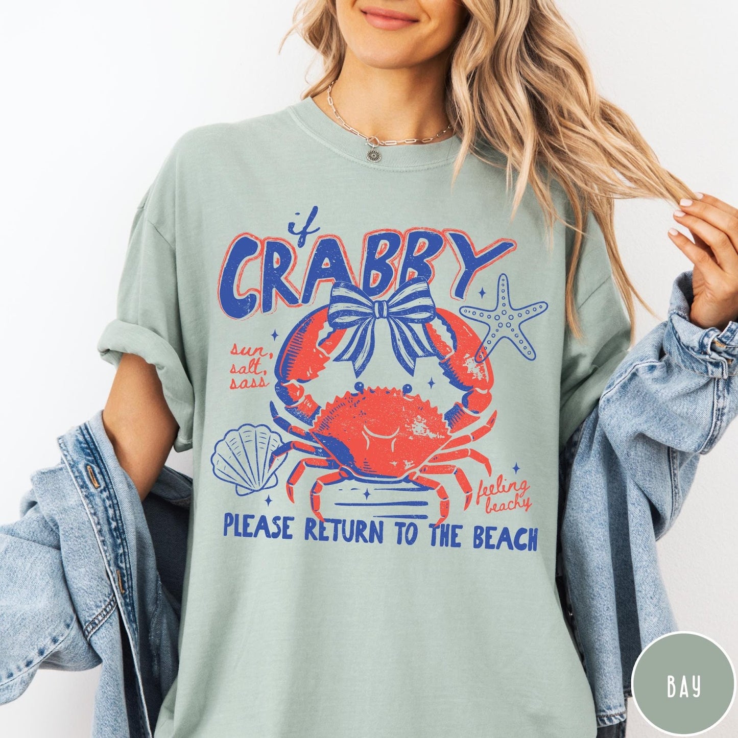 Comfort Colors tee in Bay featuring coastal graphic design with a crab, bow, starfish, and beach text