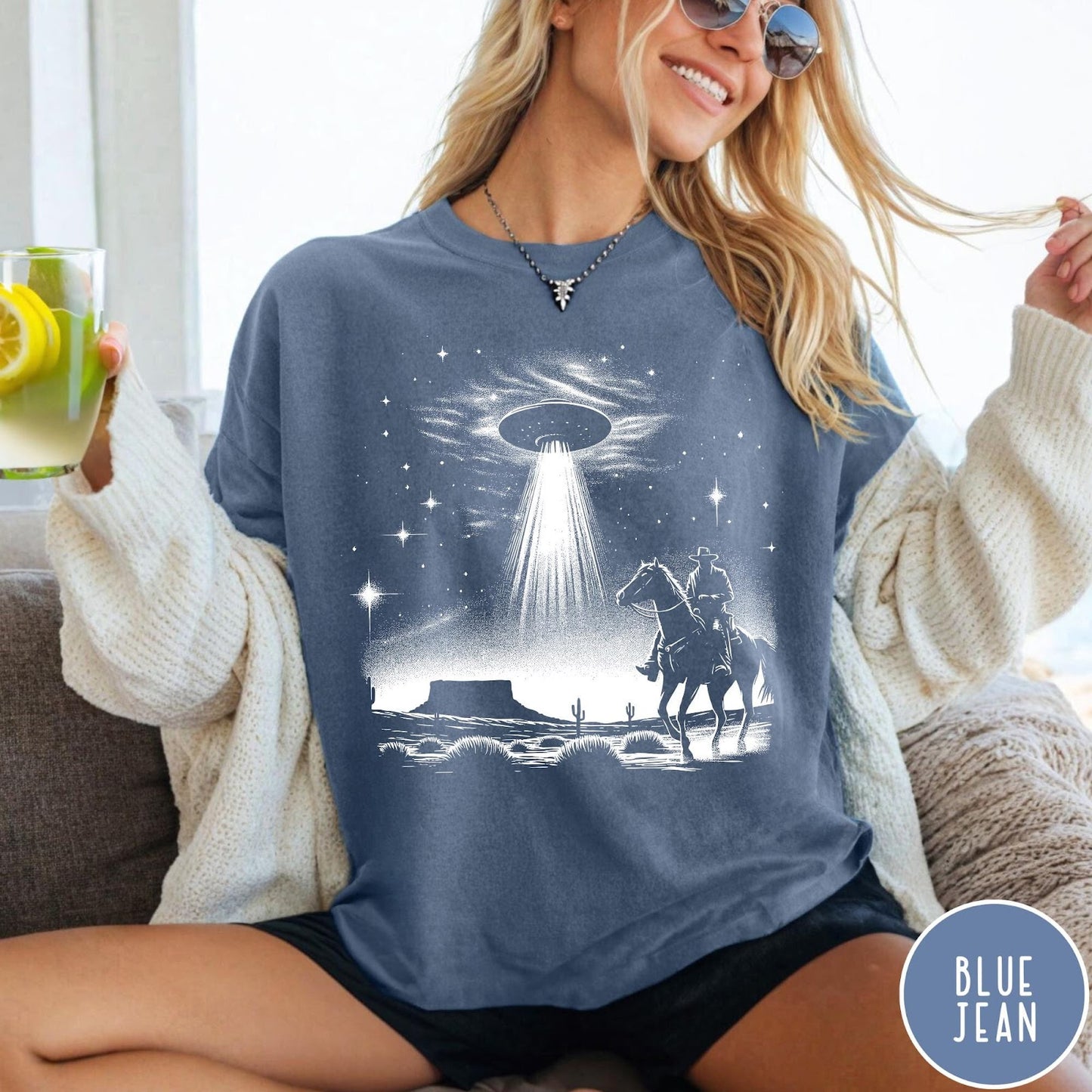 Comfort Colors tee in Blue Jean featuring western graphic style with a cowboy riding a horse under a UFO