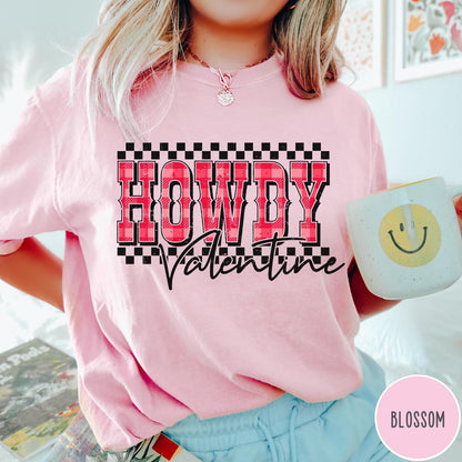 Comfort Colors tee in Blossom featuring western Valentine greeting with Howdy Valentine text and checkered border graphic