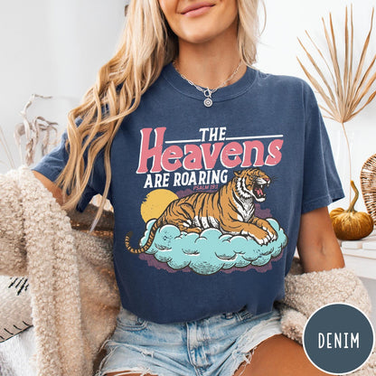 Comfort Colors tee in Denim featuring retro graphic design of a roaring tiger resting on a cloud