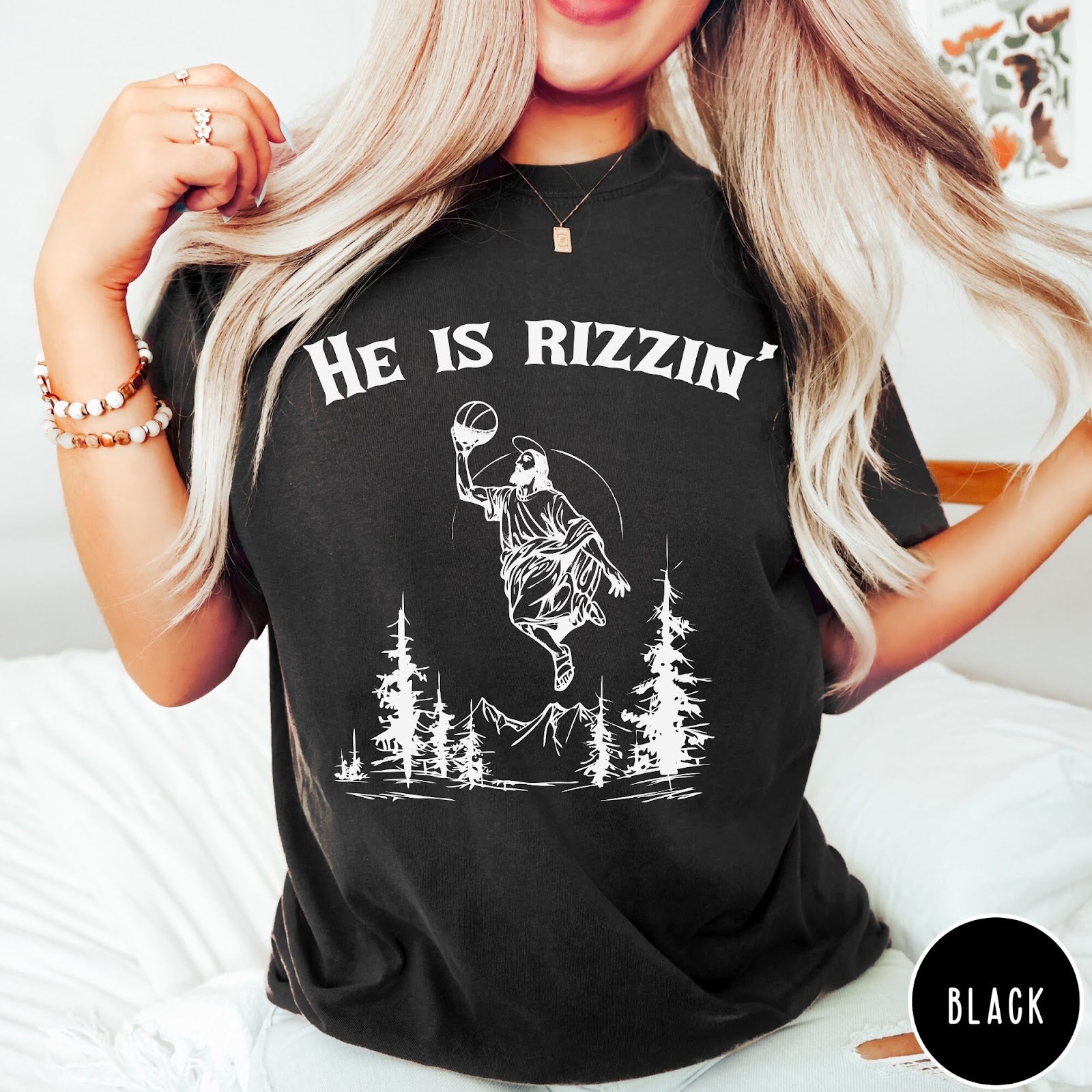 Comfort Colors tee in Black featuring graphic style Jesus playing basketball with mountains and pine trees illustration