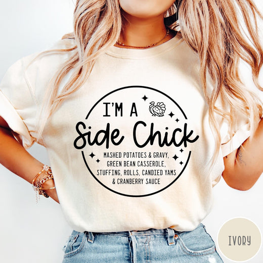 Comfort Colors tee in Ivory featuring circular Thanksgiving side dish graphic with turkey and food list