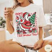 Comfort Colors tee in Ivory featuring festive goose graphic wearing a Santa hat and Christmas sweater holding tree