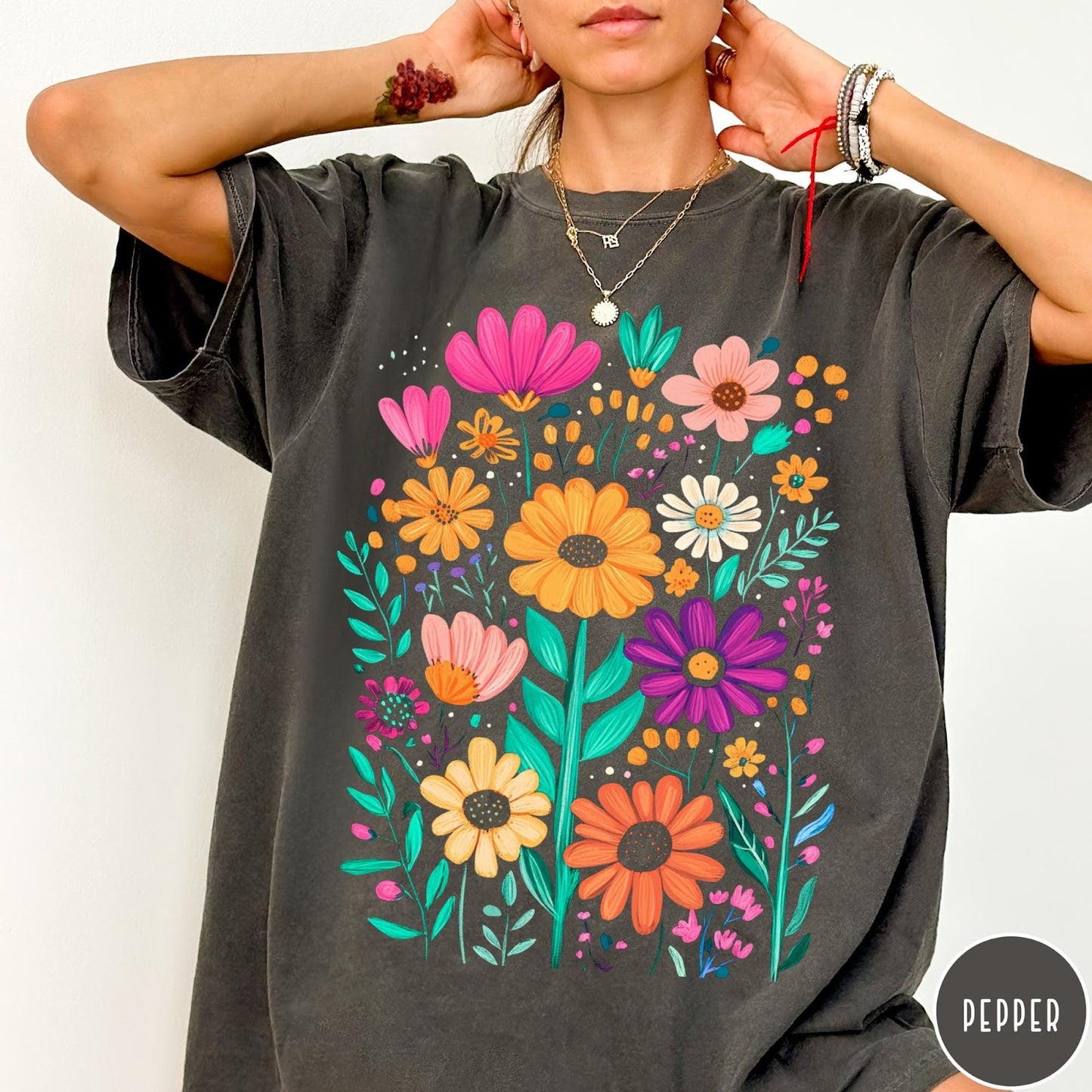 Comfort Colors tee in Pepper featuring boho style floral graphic with vibrant orange, pink, and purple flowers