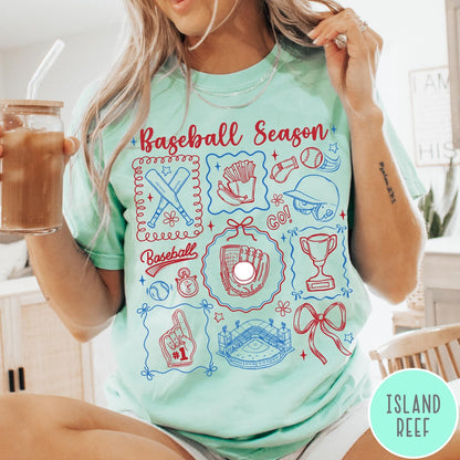 Comfort Colors tee in Island Reef featuring baseball icons including bats, a glove, stadium, and trophy graphic design