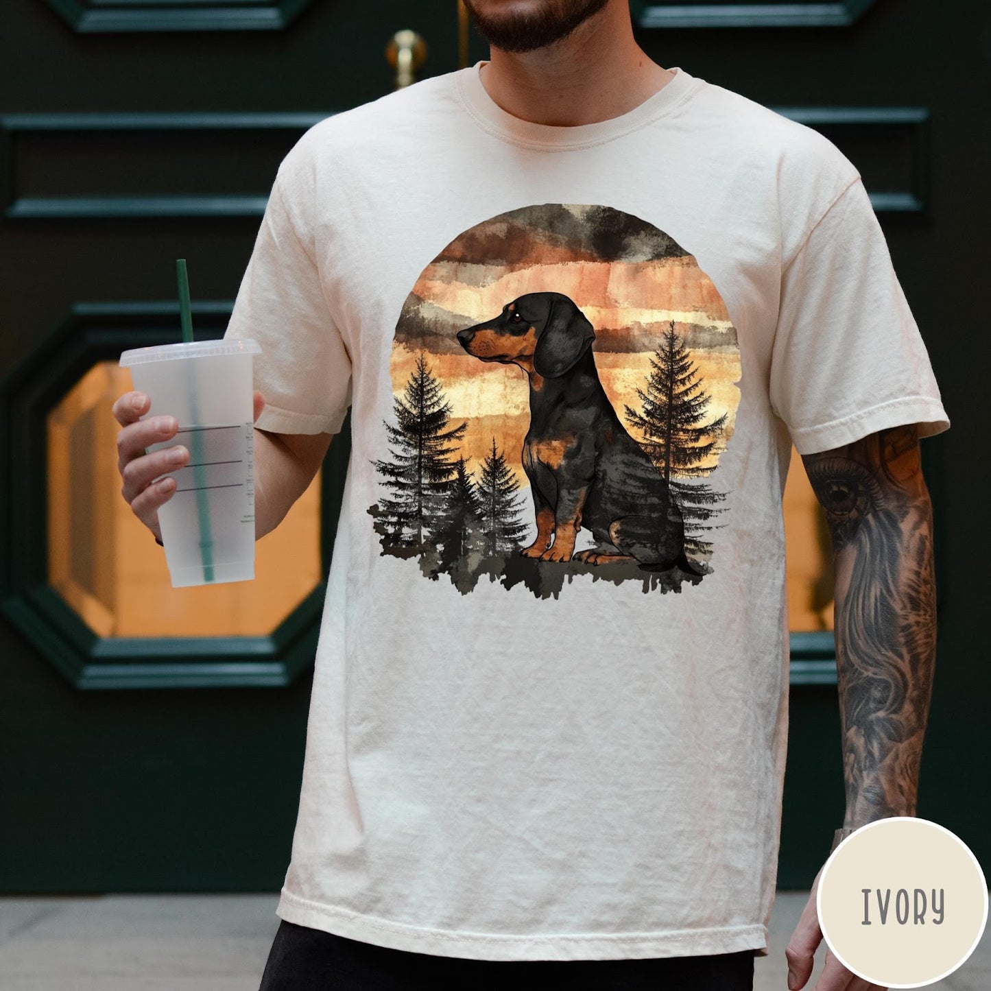 Comfort Colors tee in Ivory featuring vintage style dachshund dog graphic with forest and sunset background