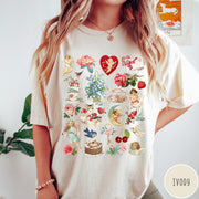 Comfort Colors tee in Ivory featuring vintage Valentine collage graphic with cherubs, flowers, cats, and romantic symbols