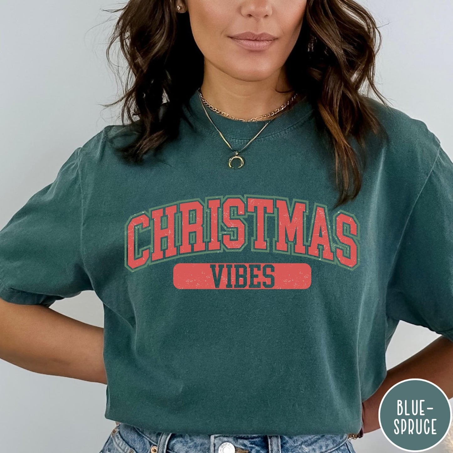 Comfort Colors tee in Blue Spruce featuring Christmas holiday theme graphic with red and green text design