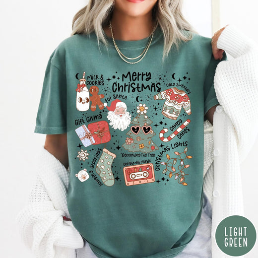 Comfort Colors tee in Light Green featuring retro holiday graphic with Santa, Christmas tree, and festive icons