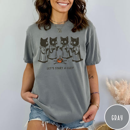 Comfort Colors tee in Gray featuring illustrated style graphic of four cats in robes around a candle