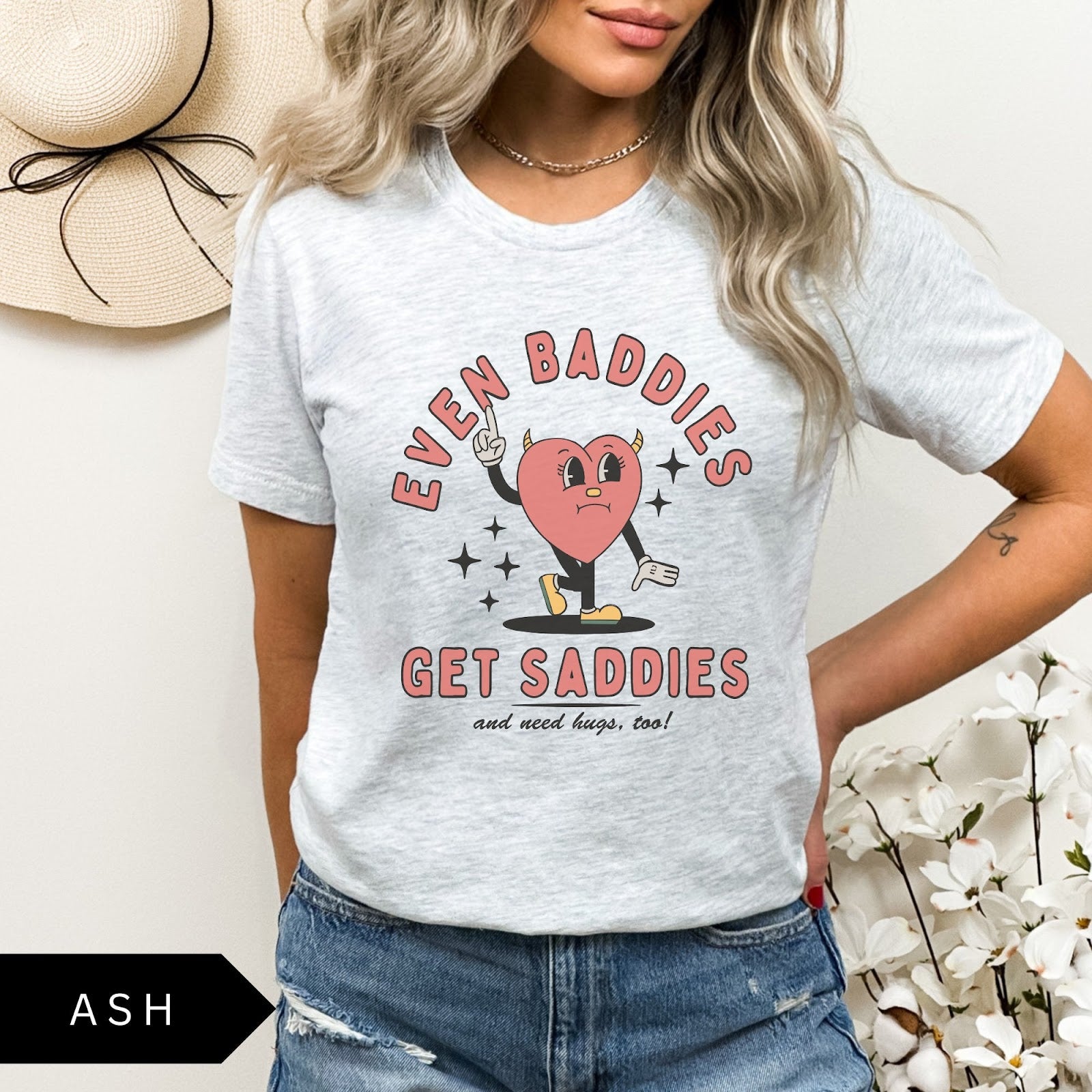 Comfort Colors tee in Ash featuring retro style sad heart character with horns and text graphic