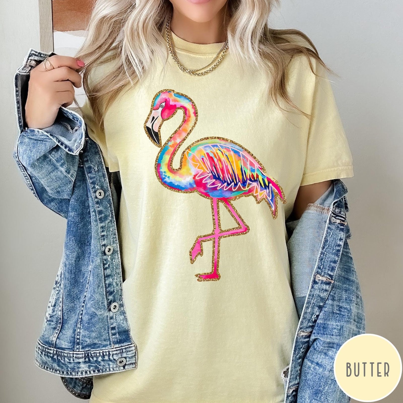 Comfort Colors tee in Butter featuring artistic watercolor flamingo graphic with gold glitter outline details