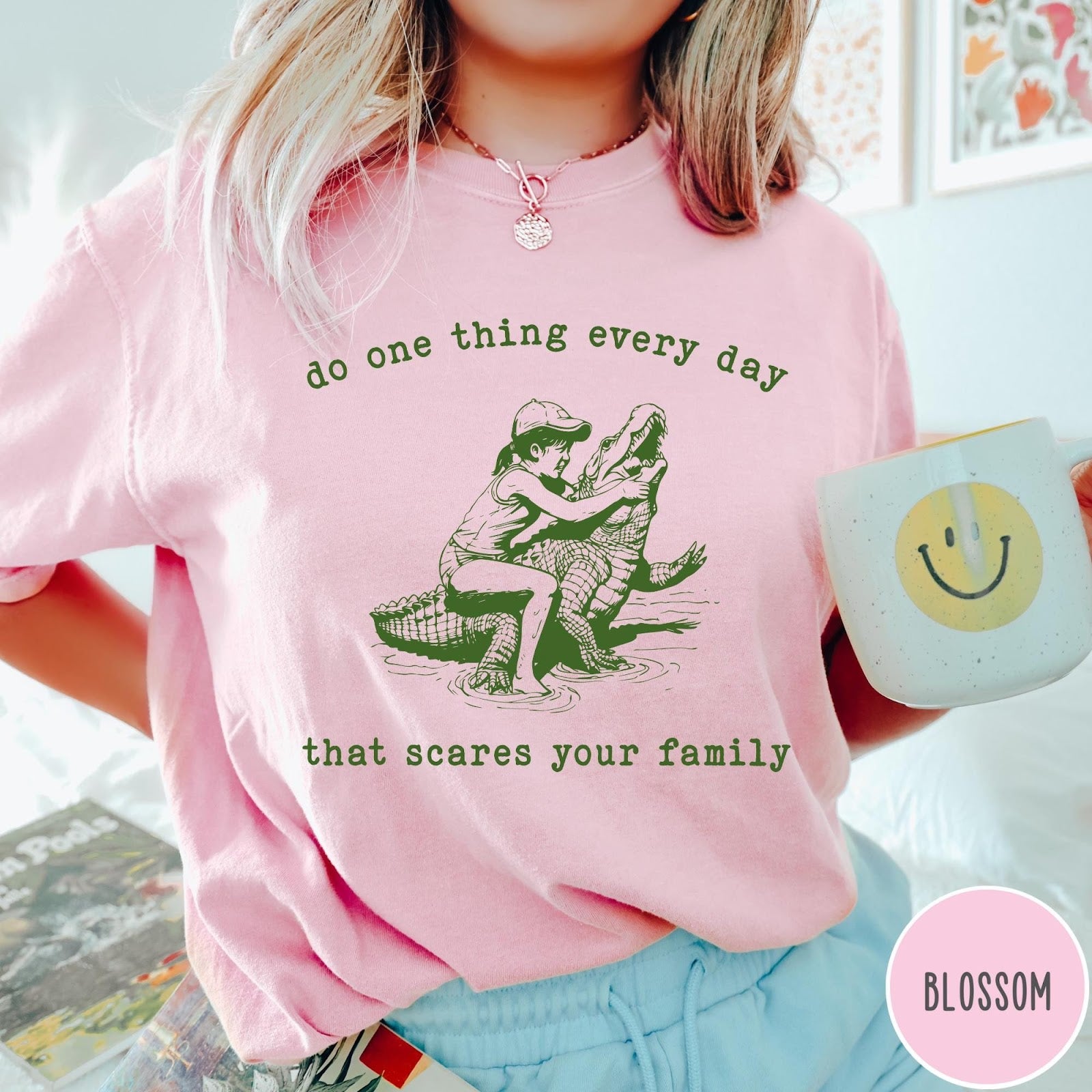 Comfort Colors tee in Blossom featuring vintage style graphic of a girl wrestling an alligator