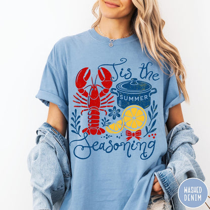Comfort Colors tee in Washed Denim featuring lobster boil graphic with a lobster, cooking pot, and lemon slices.