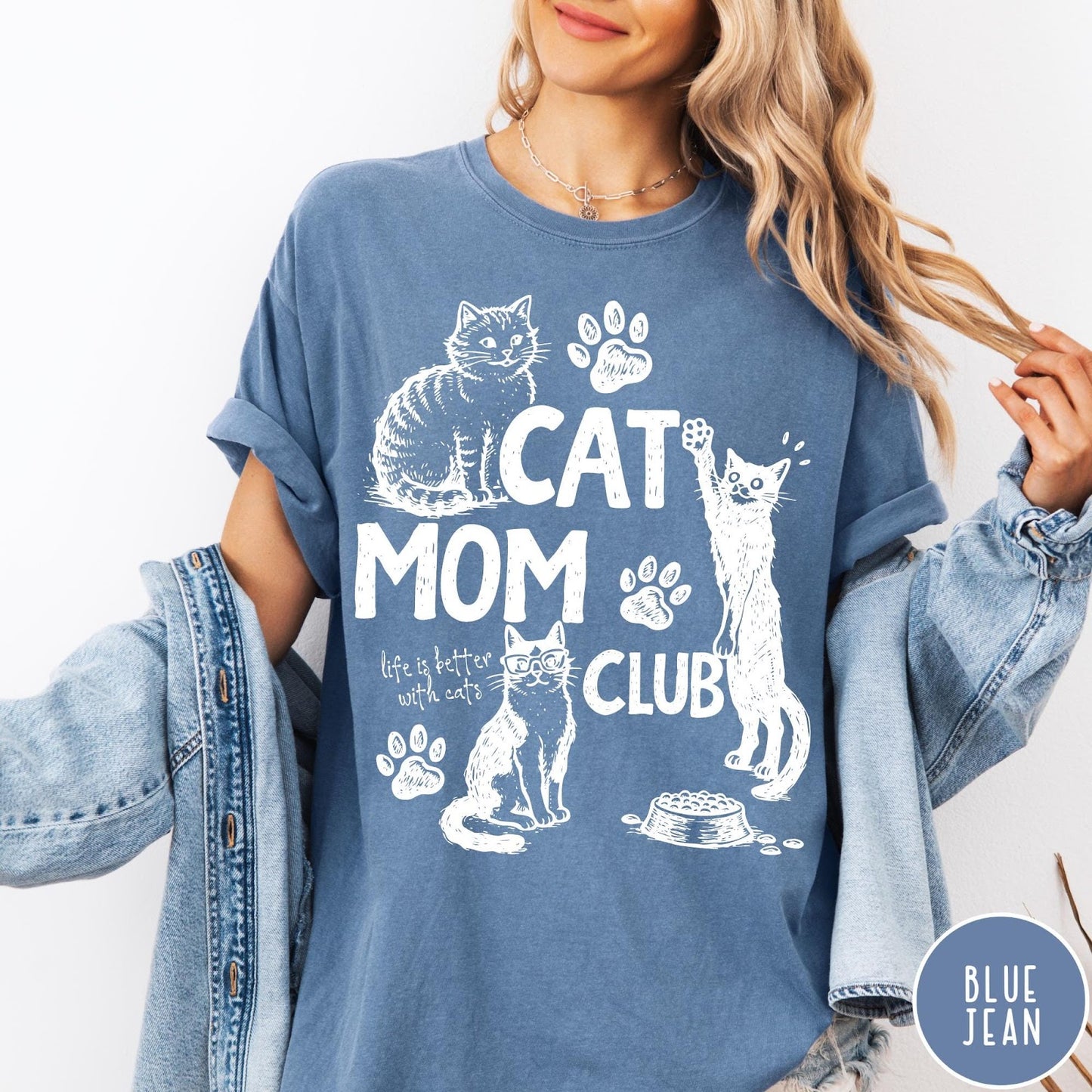 Comfort Colors tee in Blue Jean featuring vintage style graphic with cats, paw prints, and Cat Mom Club text