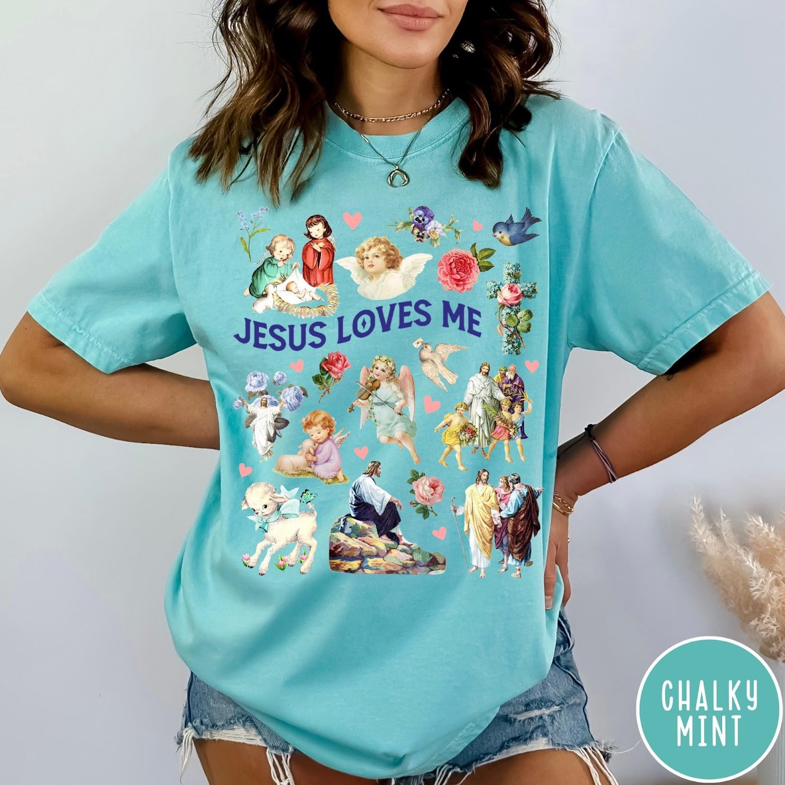 Comfort Colors tee in Chalky Mint featuring vintage religious style graphic with Jesus, angels, lambs, and floral elements