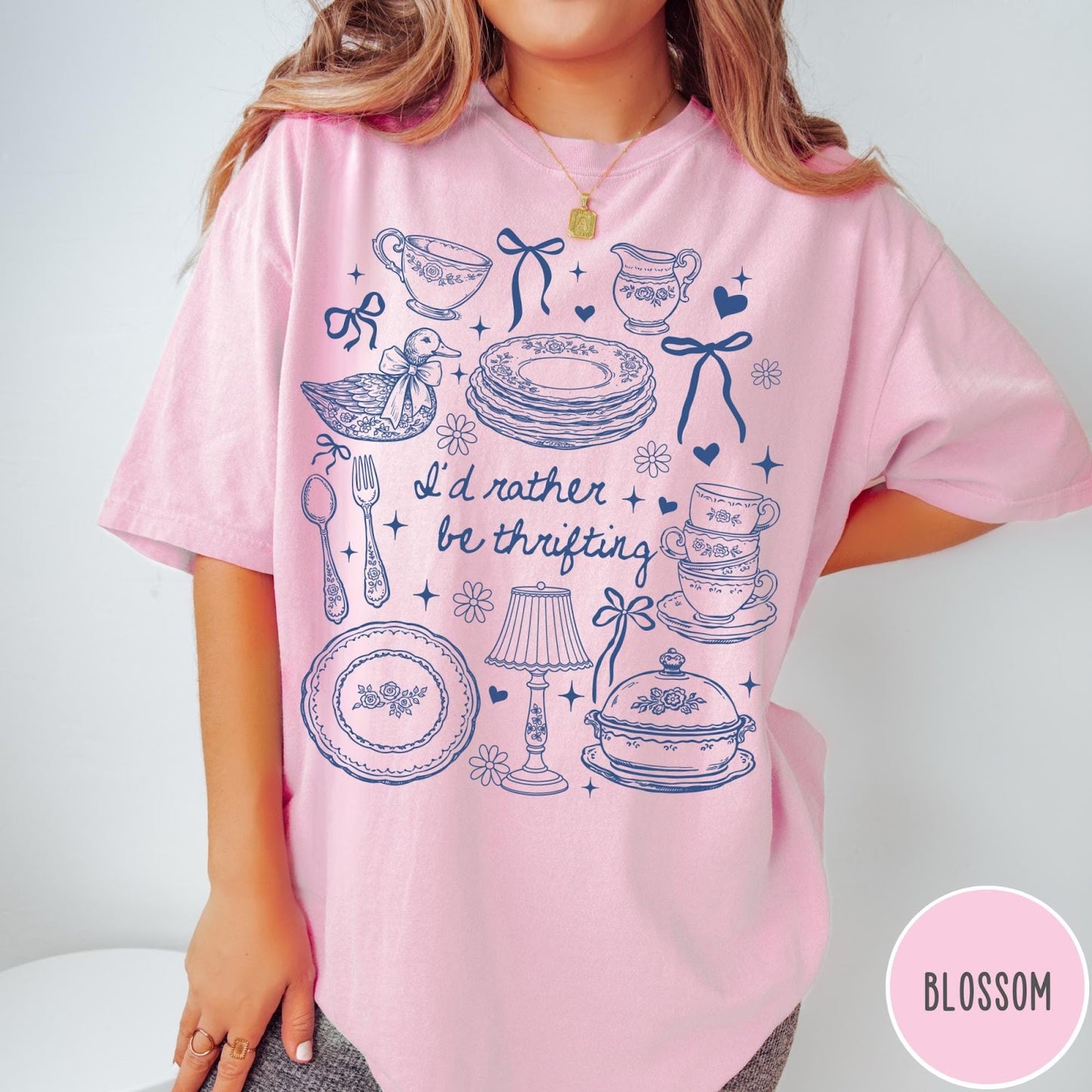 Comfort Colors tee in Blossom featuring line art graphic of antique home goods and thrifting items