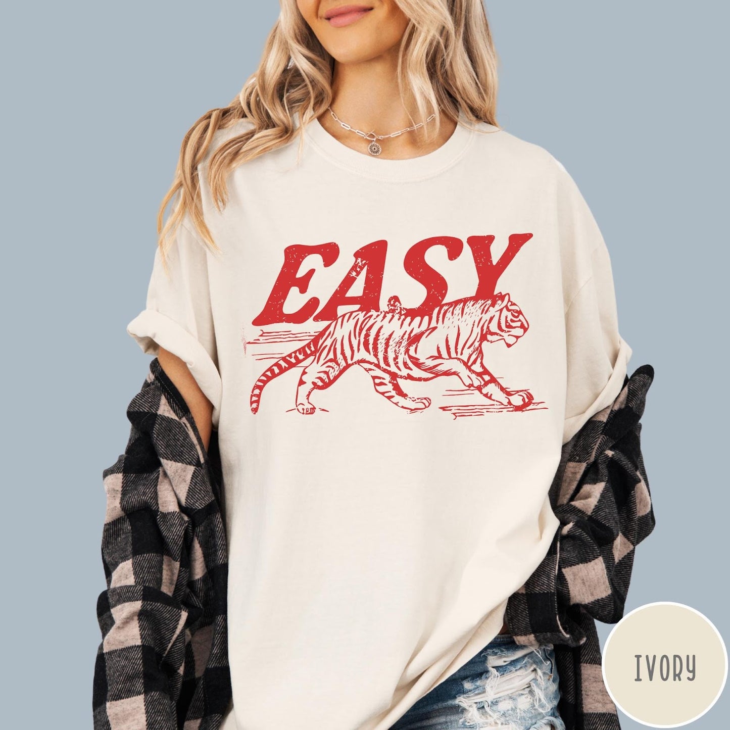 Comfort Colors tee in Ivory featuring vintage style graphic of a walking tiger and text Easy