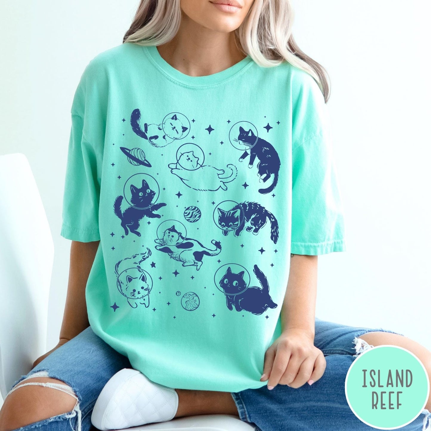 Comfort Colors tee in Island Reef featuring whimsical space style graphic with multiple cats floating in space helmets