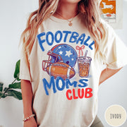 Comfort Colors tee in Ivory featuring football lifestyle graphic with helmet, football, and iced coffee drink design