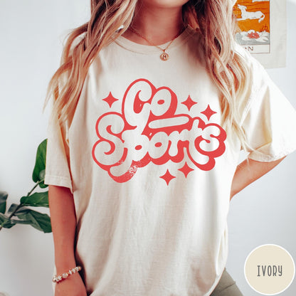 Comfort Colors tee in Ivory featuring retro sports style graphic with Go Sports text and star accents