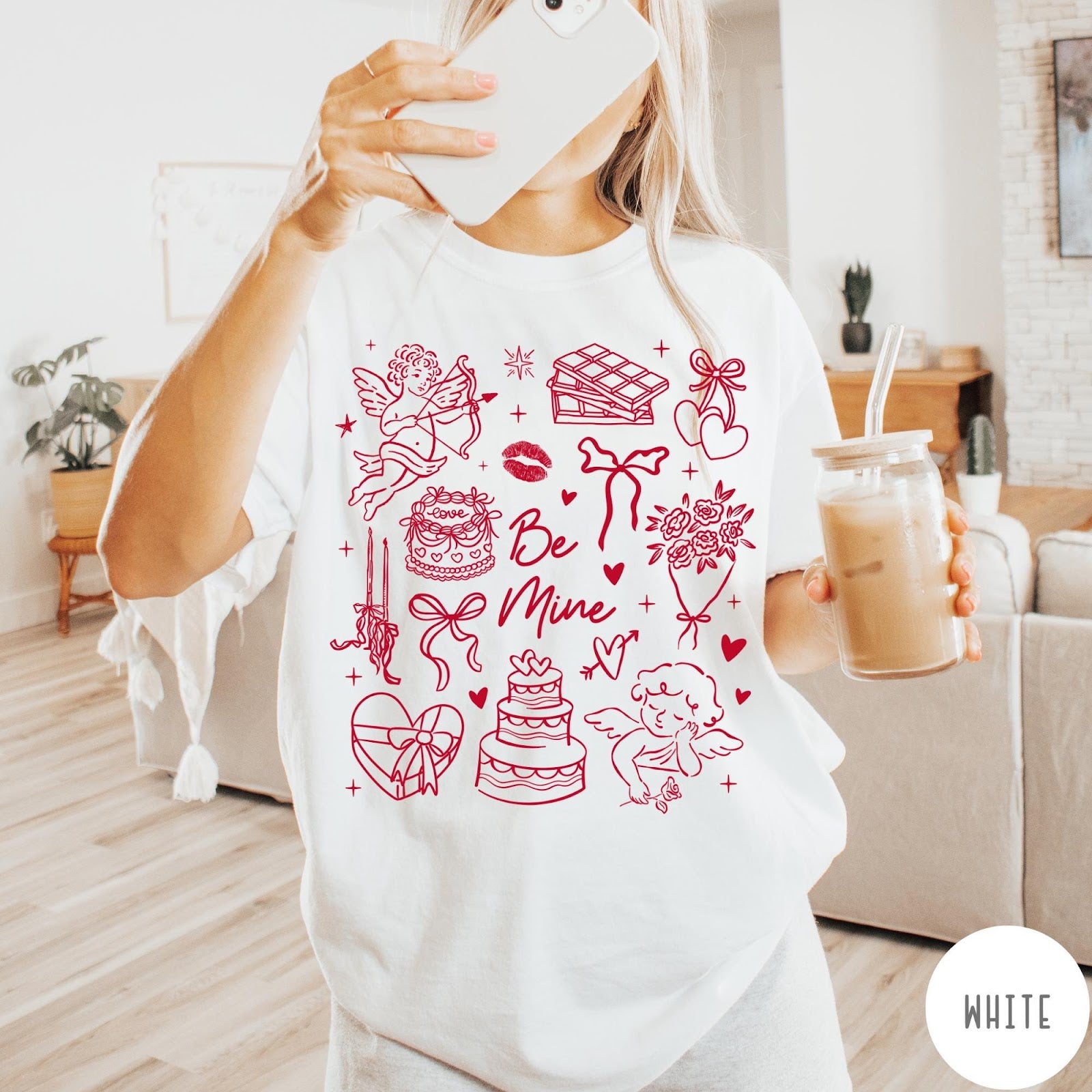 Comfort Colors tee in White featuring Valentine's Day collage graphic with cupid, cakes, and romantic symbols.