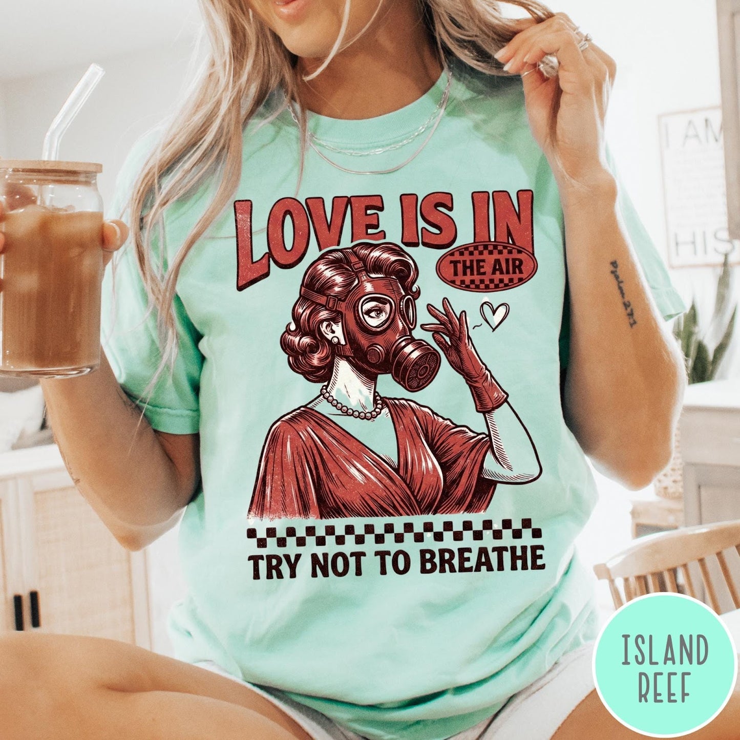 Comfort Colors tee in Island Reef featuring retro graphic design of a woman wearing a gas mask