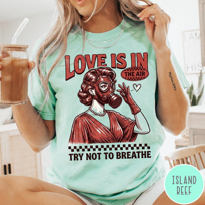 Comfort Colors tee in Island Reef featuring retro graphic design of a woman wearing a gas mask